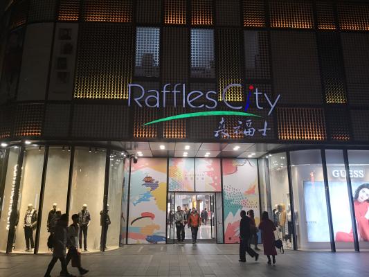 A customer is seen by an Ochirly store in Shanghai, China, 13